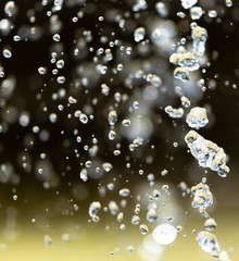 Water splashing from a fountain on summer nature