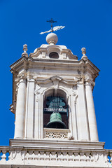 Fototapeta na wymiar Old bell tower of a Portuguese white church in Lisbon, Portugal