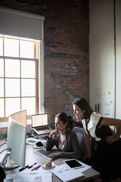 Creative Businesswomen Working At Computer In Office