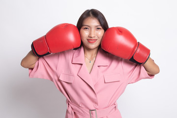 Young Asian woman with red boxing gloves.