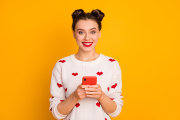Portrait of her she nice-looking attractive lovely glamorous pretty charming cute cheerful cheery girl using cell 5g app web service isolated over bright vivid shine vibrant yellow color background