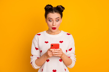 Fototapeta na wymiar Portrait of her she nice glamorous attractive lovely pretty lovable charming cute cheerful amazed girl using cell app web service isolated over bright vivid shine vibrant yellow color background