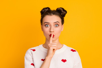 Close-up portrait of her she nice attractive lovely pretty charming cute mysterious girl showing shh sign keeping secret isolated over bright vivid shine vibrant yellow color background