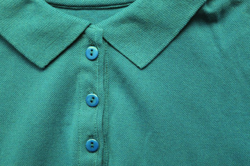Polo shirt close up view of persian green color tone clothes. Dark green and light blue colour mix...