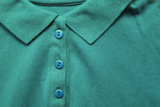 Polo Shirt Close Up View Of Persian Green Color Tone Clothes. Dark Green And Light Blue Colour Mix T-shirt, Buttoned Up Polo Top View On The Clothing Store Aisle 