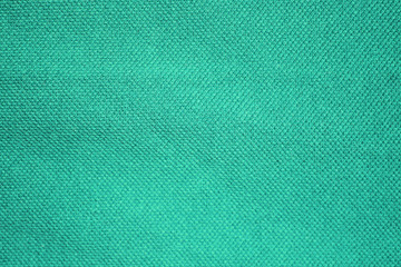 Texture background of mint green or light azure blue color. Grainy fiber cloth material, abstract rough wall pattern, empty colorful backdrop with copy space