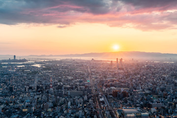 Naklejka na ściany i meble Skyline in Osaka, Sunset view of the Cityscapes