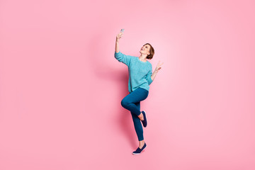 Fototapeta na wymiar Full length body size view of her she nice attractive lovely cheerful cheery brown-haired girl having fun making taking selfie showing v-sign isolated over pink pastel color background