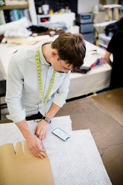 Male Fashion Designer Working In Studio