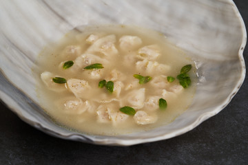 Traditional Azerbaijani cuisine, soup with small dumplings with a lot of spices