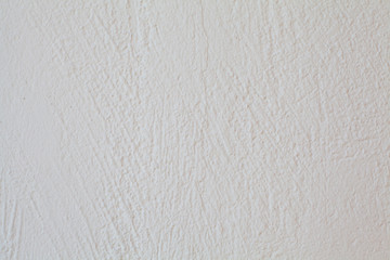 White and colorful messy wall stucco texture background. Decorative wall paint.