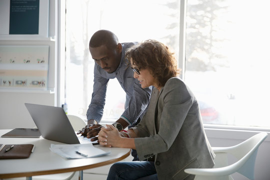 Business People Using Laptop In Conference Room Meeting