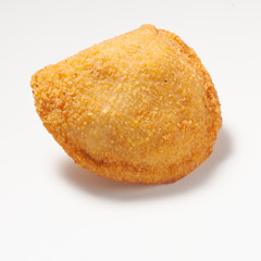 Rissole, a small patty enclosed in pastry, or rolled in breadcrumbs, usually baked or deep fried, filled with savory ingredients. Isolated on a white background.
