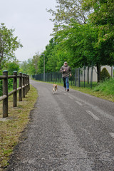 Fototapeta na wymiar man running with his dog
