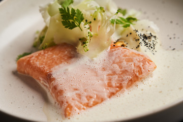 Trout fish sous vide with mashed cauliflower and mussel sauce