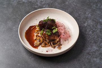 Lamb meat with pickled radish, mushrooms and demi glace sauce