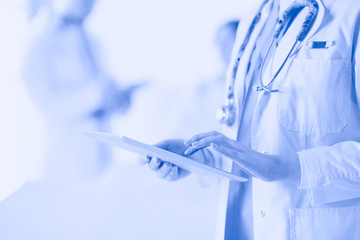 Doctor man in surgery examining young woman