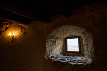 Fototapeta na wymiar Window of a medieval fortress