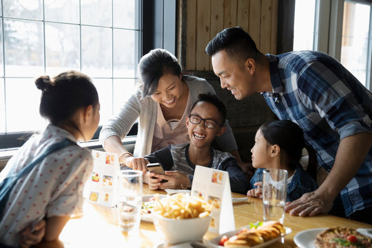 Family Eating Lunch In Restaurant