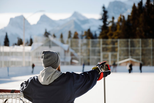 Man Playing Outdoor Ice Hockey