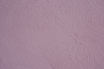 Beautiful purple textured stucco on the wall.