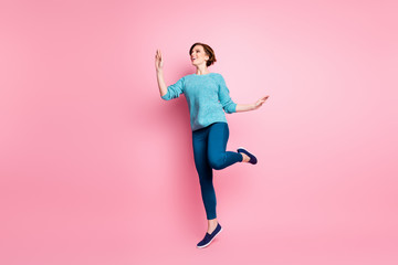 Full length body size view of her she nice attractive lovely dreamy carefree cheerful cheery brown-haired woman having fun dancing walking isolated over pink pastel color background