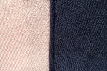 Fototapeta premium Vertical seam between pink and navy blue jersey fabric