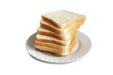 Pile of toasted bread slices on a single white plate. Isolated on white background.