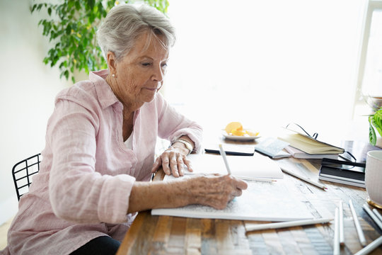 Senior Woman Coloring In Coloring Book