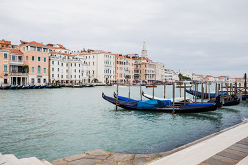 Obraz na płótnie Canvas canal with gondolas and ancient buildings in Venice, Italy