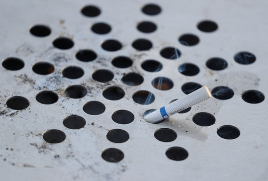 A discarded cigarette butt is seen in an ashtray in central Kiev