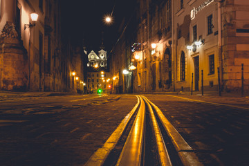 Fototapeta na wymiar illuminated street at night. Old european city