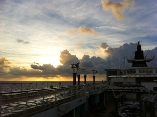 Sunset or sunrise at sea with view from cruiseship or cruise ship liner during Caribbean cruising