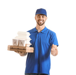 Handsome worker of food delivery service showing thumb-up on white background