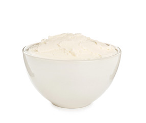 Bowl with tasty cream cheese on white background