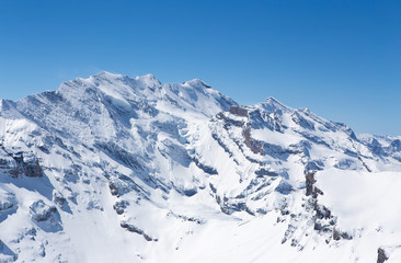 Winter landscape, Mountains covered by snow with clear blue sky without clouds in sunnyday winter in Switzerland