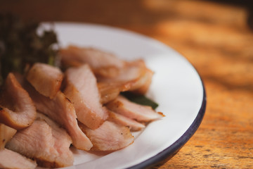 Grilled pork neck on white dish