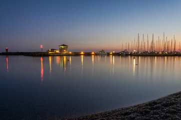 Night port with luxury sailing yachts