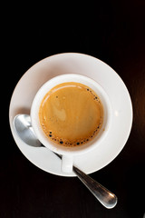 a cup of coffee and white book on a table, background, textures