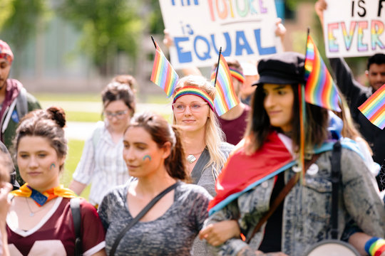Students marching with banners at gay pride parade