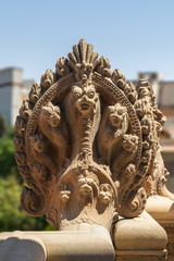 Fototapeta na wymiar Hindu statue of snakes. One of the statues studding the terrace of the historical palace of Baron Empain, Cairo, Egypt