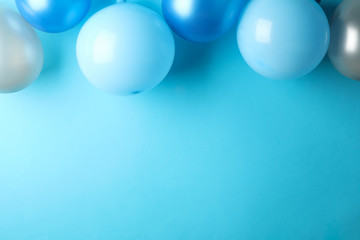Balloons on blue background, space for text