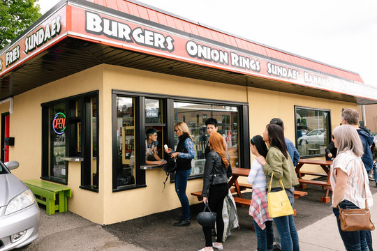 Customers Waiting In Line Outside Drive-in Window