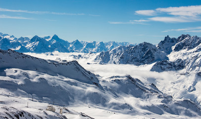 Fototapeta na wymiar Zermatt sea of clouds in valley mountains emerging view perfect sky