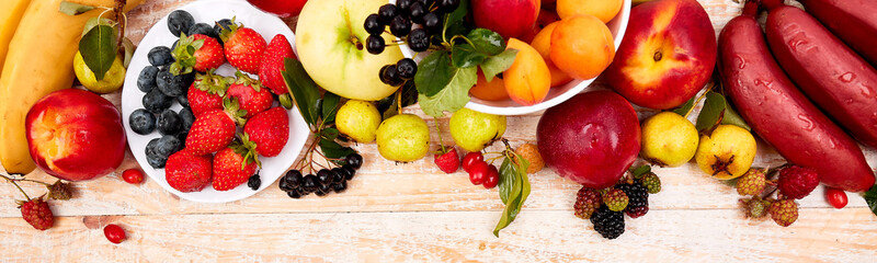 Banner with Flat lay of fruits over white wooden background