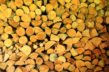 Wooden background. Firewood for the winter, stacks of firewood, pile of firewood