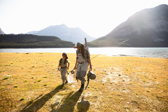 Mother And Son Fly Fishing At Sunny, Scenic Lake