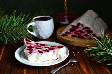 Home made cherry cake Izba on a wooden table.