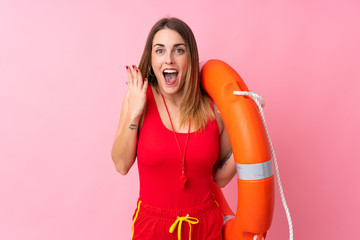 Lifeguard woman over isolated background with surprise facial expression