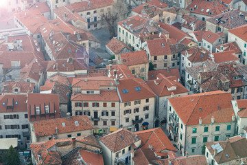 Fototapeta na wymiar Red tiled roofs of old town houses in Kotor